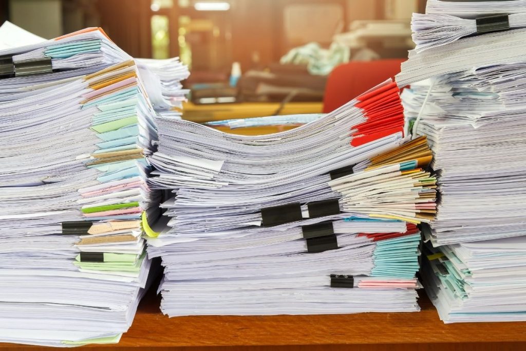 overwhelming stacks of papers